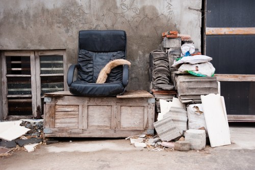 Front of a skip being loaded at a site entrance